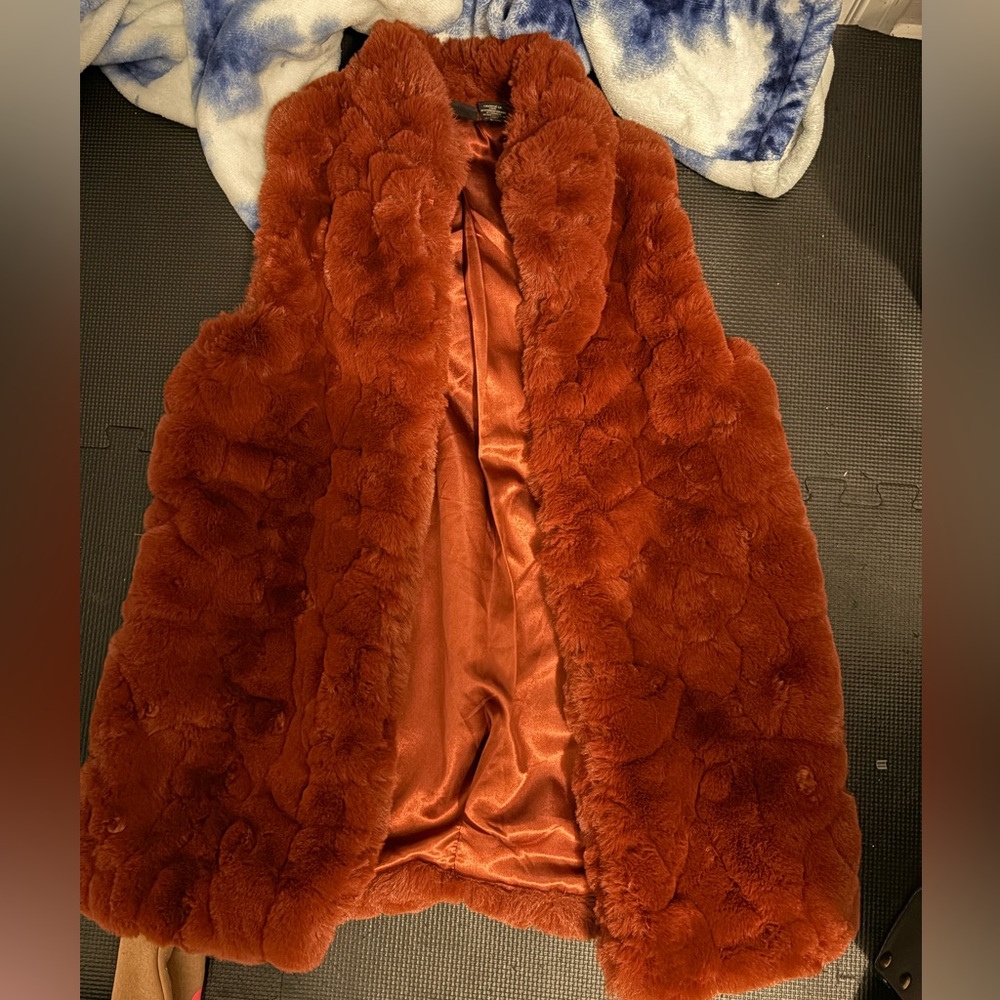Size small rusty colored women’s silk and fur vest